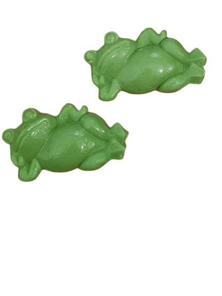 Two green icing decorations shaped like frogs, approximately 5.5cm in length, set against a white background.