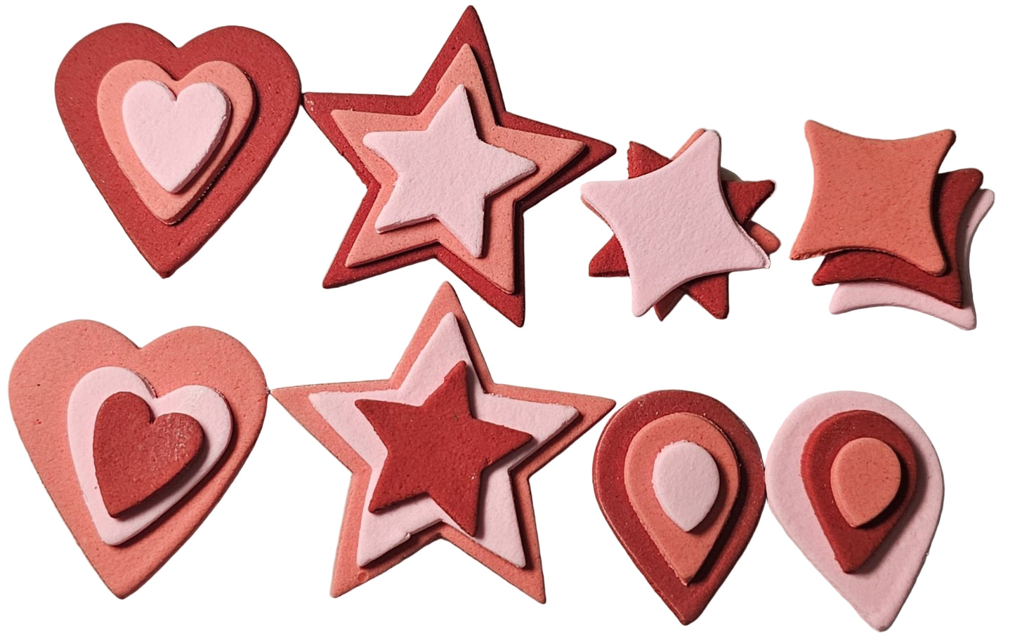 Set of 8 assorted icing shapes in pink and burgundy colors, including heart, star, teardrop, and pillow shapes.
