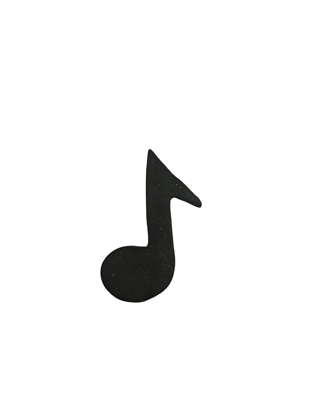 Black musical note symbol on a white background made out of fondant.