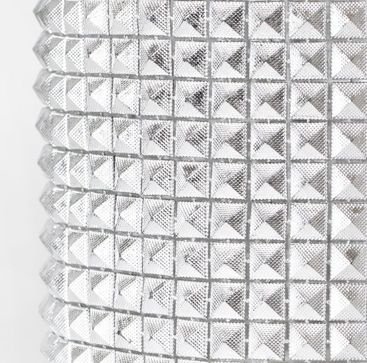 A close-up of a silver glam ribbon with a diamond pattern, typically used for cake decoration.