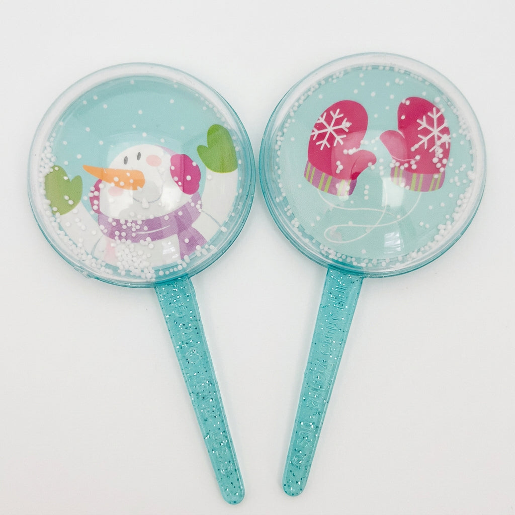 Pack of four 3D snow globe cake decorations on picks, suitable for Christmas cakes, cupcakes, desserts and winter themed celebrations.