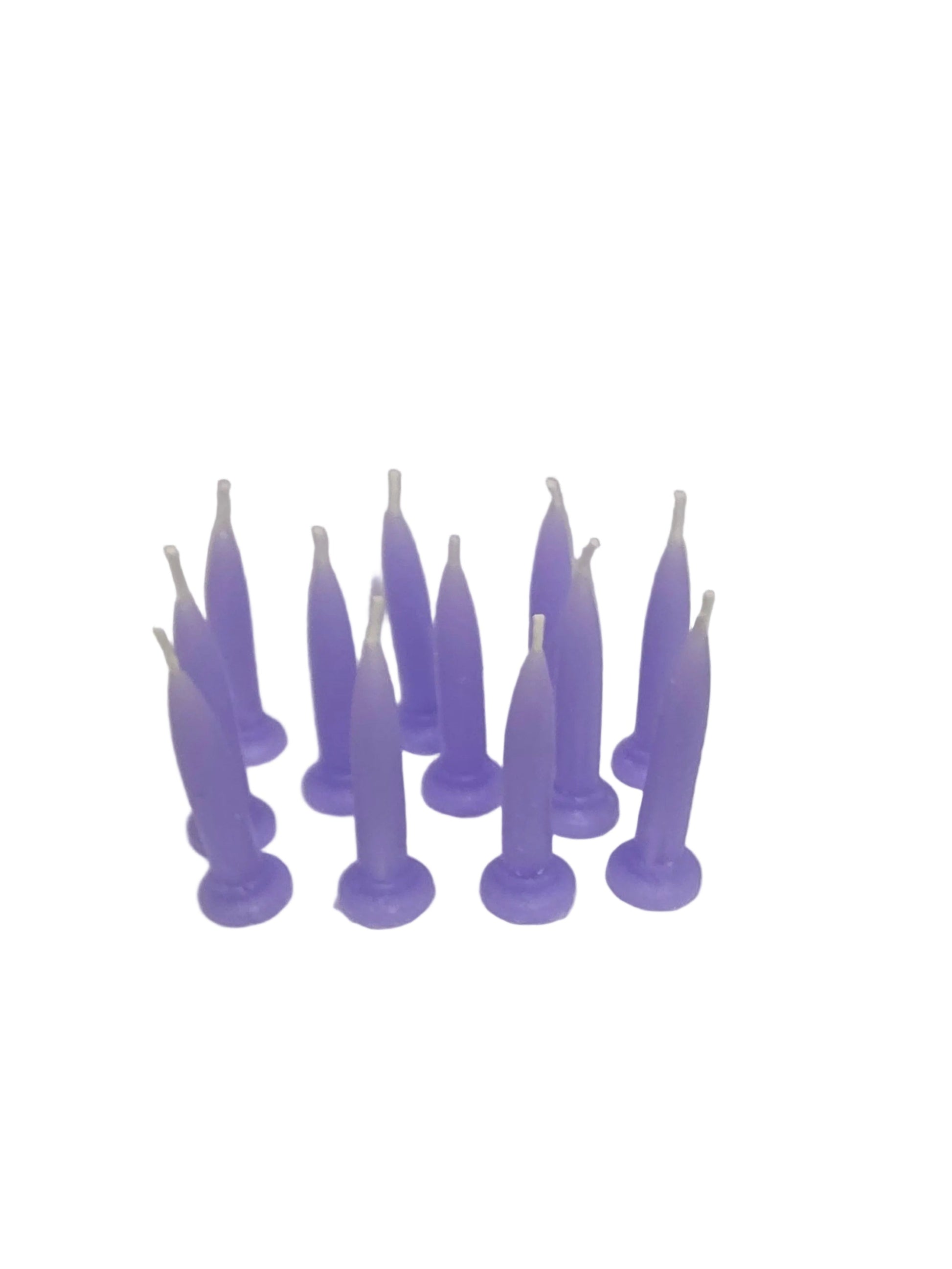Packet of 12 lavender bullet candles arranged upright, soft pastel colour suitable for birthday cakes.