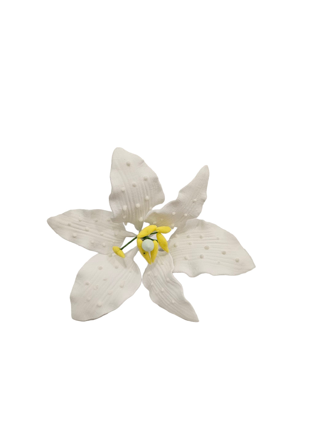 Handcrafted Casablanca Lily. Made from sugar paste, this graceful bloom features soft white petals with tiny white icing dots and vibrant yellow icing stamens on wire.