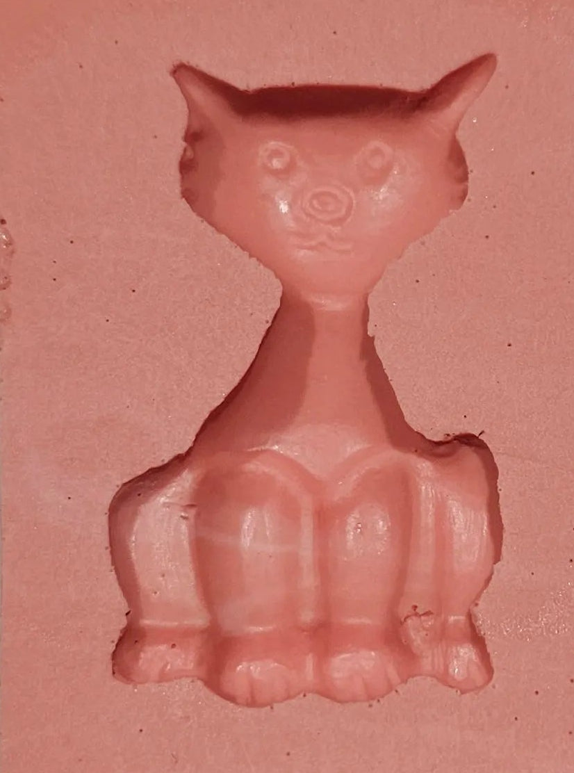 Small cat-shaped silicone mould with detailed cavities for fondant, chocolate and cake decorating.