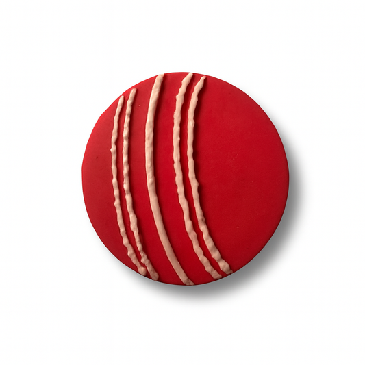 Large fondant cricket ball with white seam detail, approx. 7 cm.