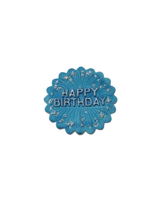 Raised lettering Happy Birthday plaque in blue fondant with scalloped edge.