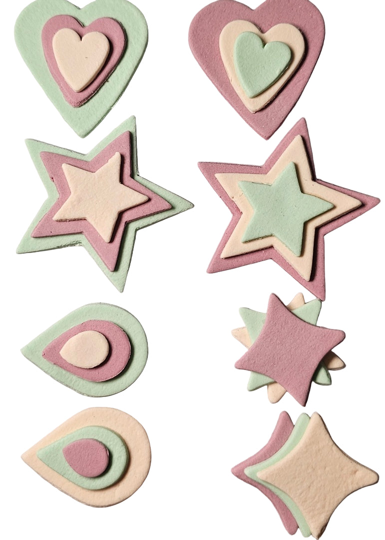 Set of 8 assorted icing shapes in lilac, apricot, and pale green, including heart, star, teardrop, and pillow shapes.