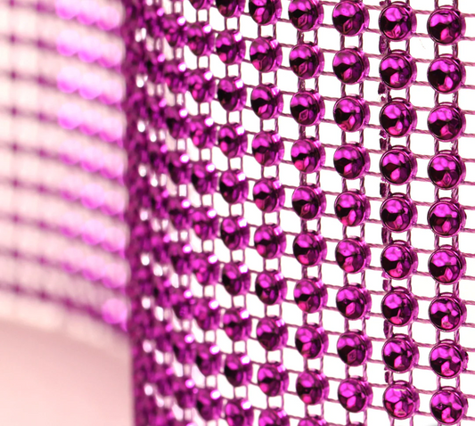 Purple glam ribbon with sparkling concaved stone shapes that create a diamond‑illusion shine. Non‑edible decorative ribbon for cakes and event décor.