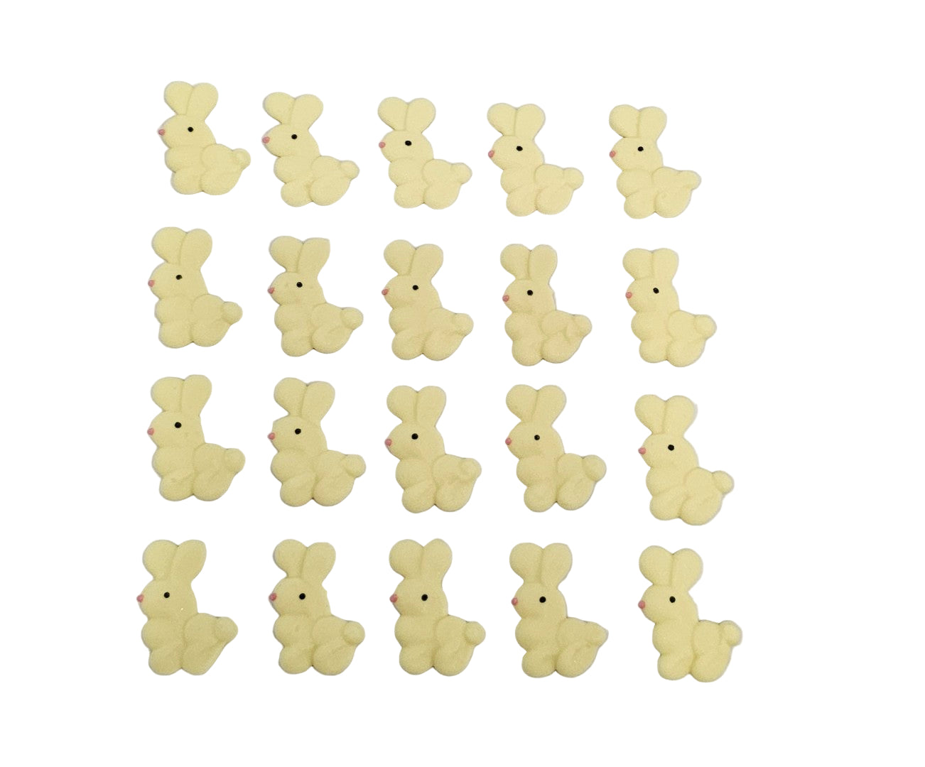 Yellow bunny-shaped made out of royal icing on a white background