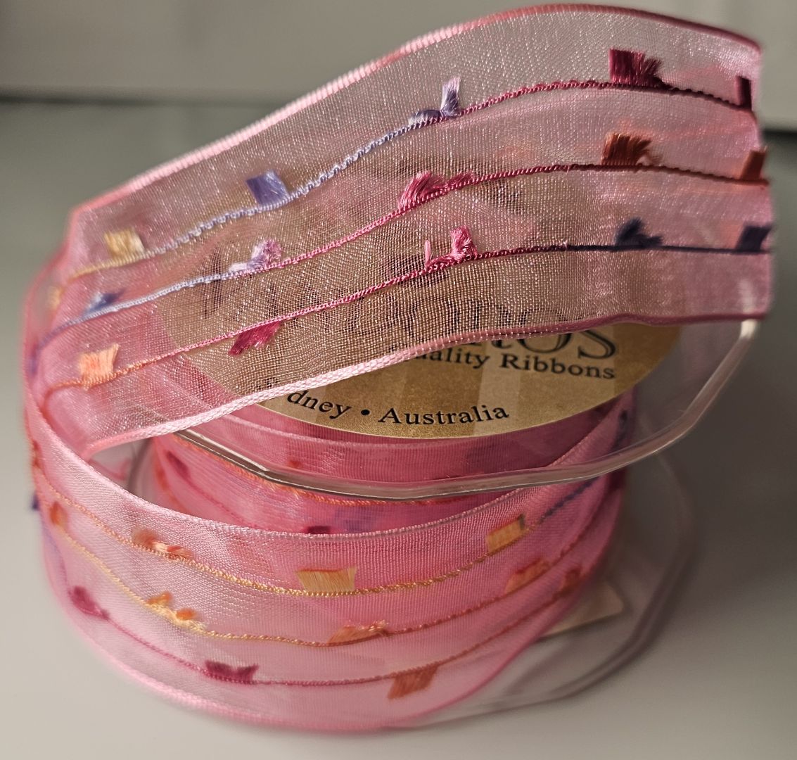Sheer pink ribbon with colourful square print, 38mm wide and 8.9m long.