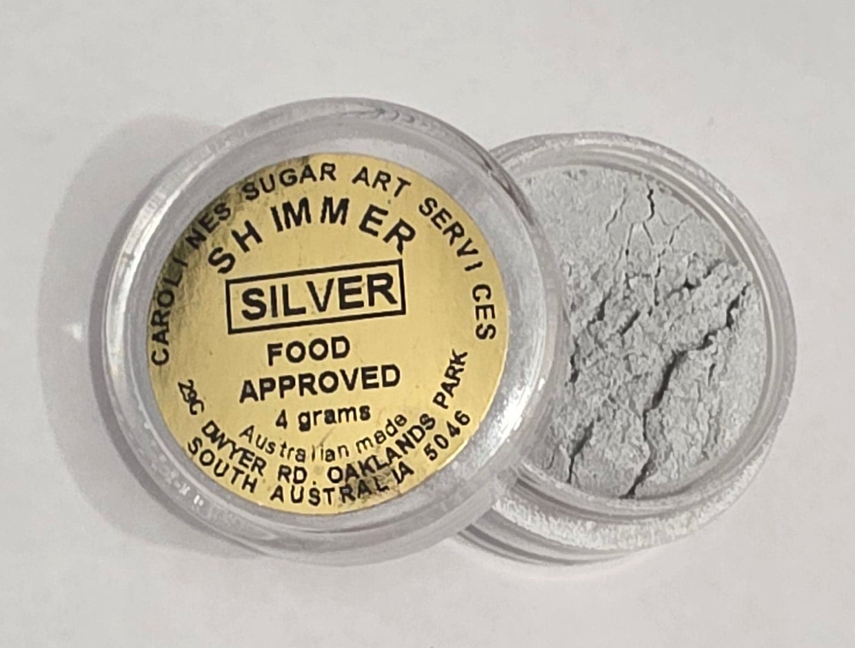 Small 4g pot of Caroline’s Silver Shimmer Dust with a bright metallic silver finish, used to add edible shimmer to cakes and fondant decorations.