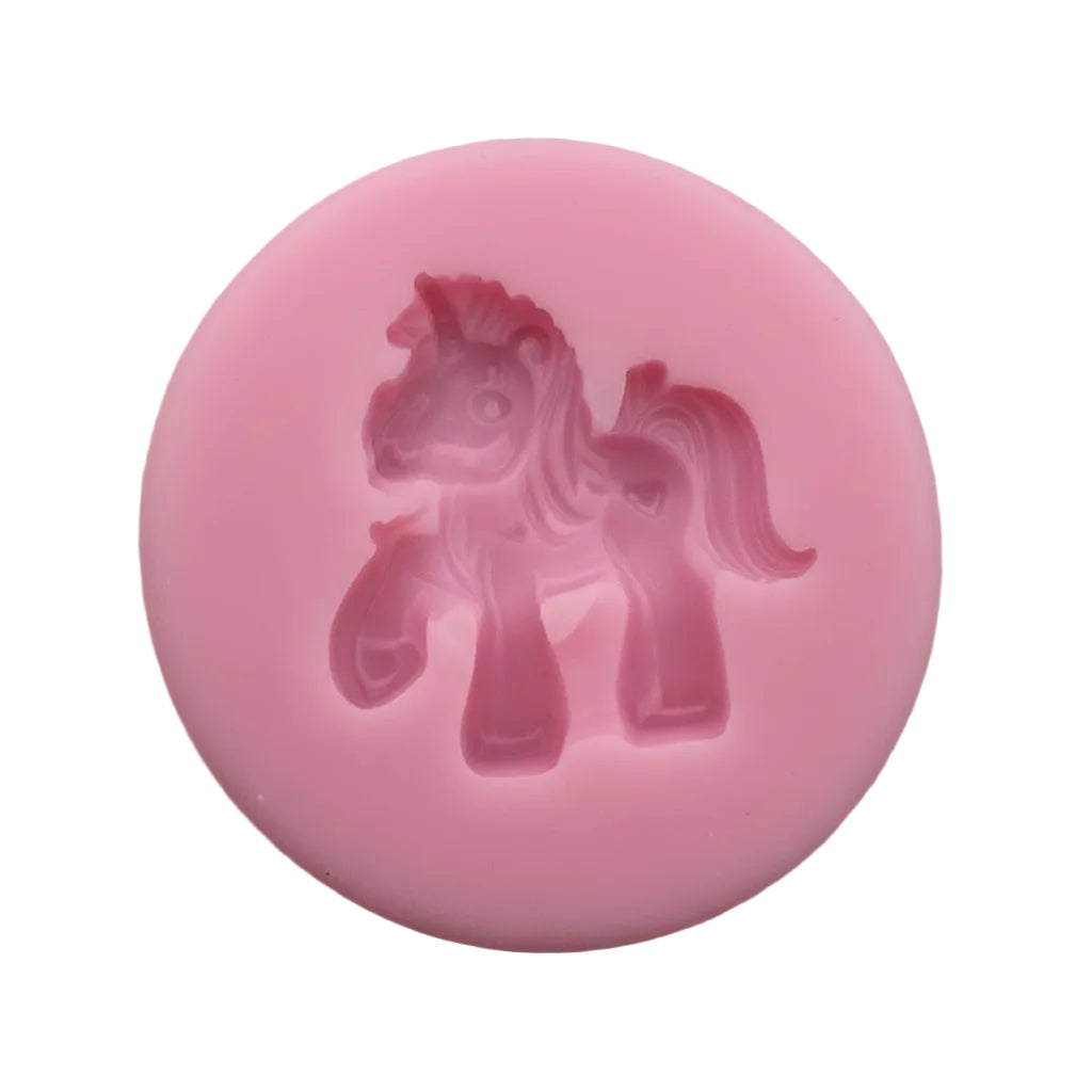 Pink unicorn figurine silicone mold on a white background.