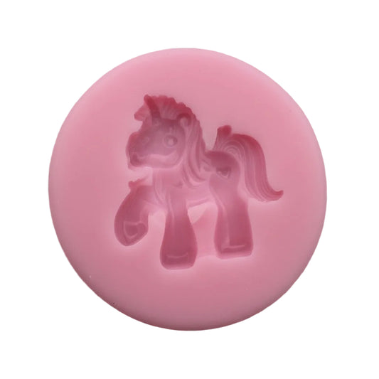 Pink unicorn figurine silicone mold on a white background.