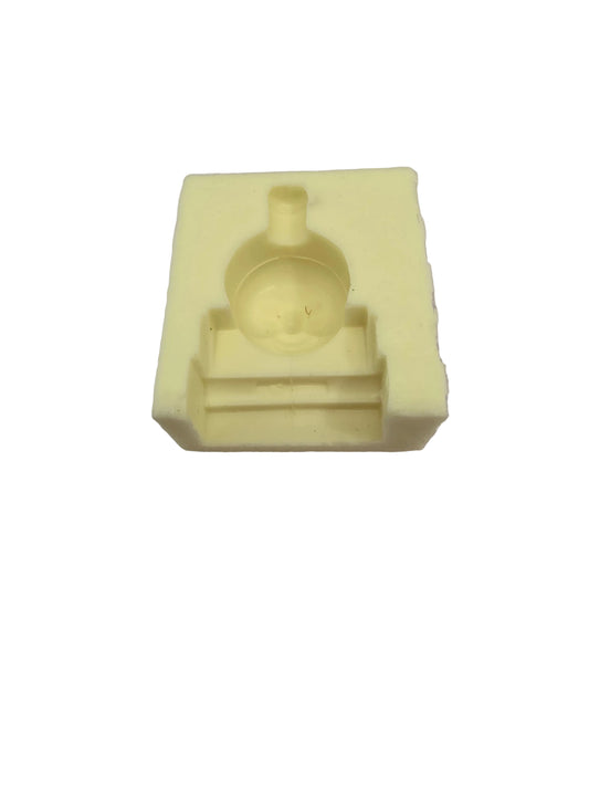 Small yellow silicone mould featuring the face of Thomas the Tank Engine, sized approximately 4cm by 3.2cm, used for fondant, chocolate or clay crafting.