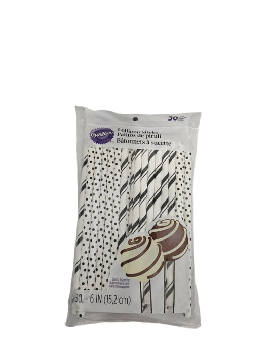 Pack of Wilton black and white 6‑inch lollipop sticks for cake pops and treats.