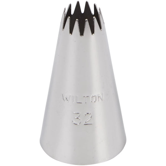A close-up of the Wilton Nozzle Number 32, showing its star-shaped tip and the engraved text 'Wilton 32'.
