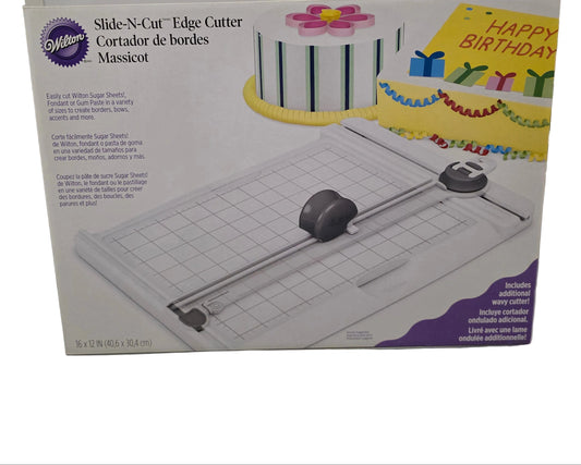 Wilton Slide N Cut Edge Cutter with a 9x12 inch marked cutting surface and sliding blade.
