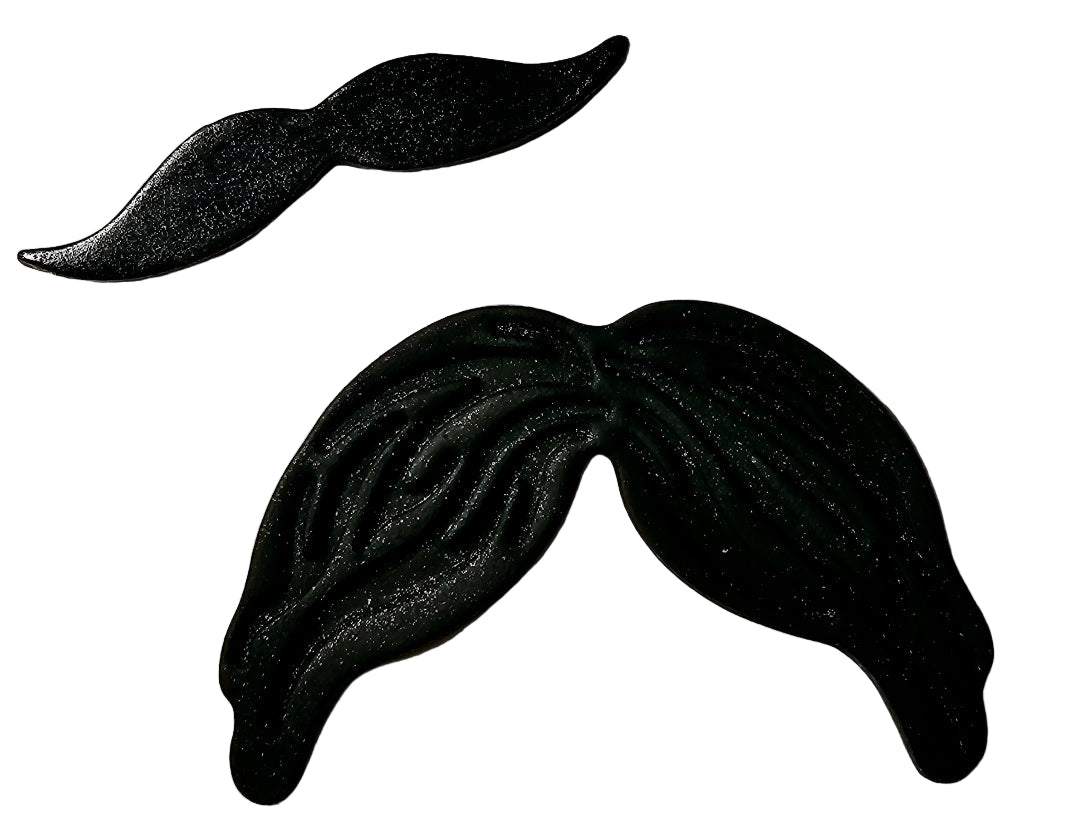 Two black icing moustaches of different sizes, designed to celebrate Movember or Father's Day.