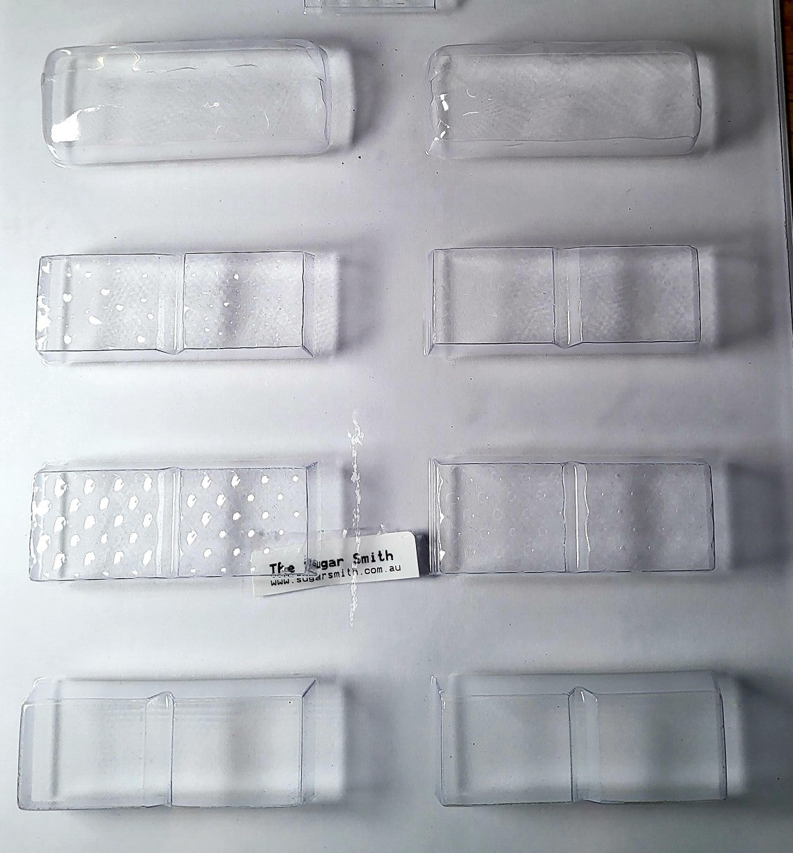 Craft your own mini chocolate bars with our Assorted Small Bars Chocolate Mould, featuring 8 cavities across 4 deliciously distinct styles:
