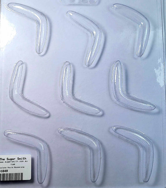 A clear plastic chocolate mould with 9 cavities, arranged in a boomerang shape, packaged on a white background with a label at the bottom.