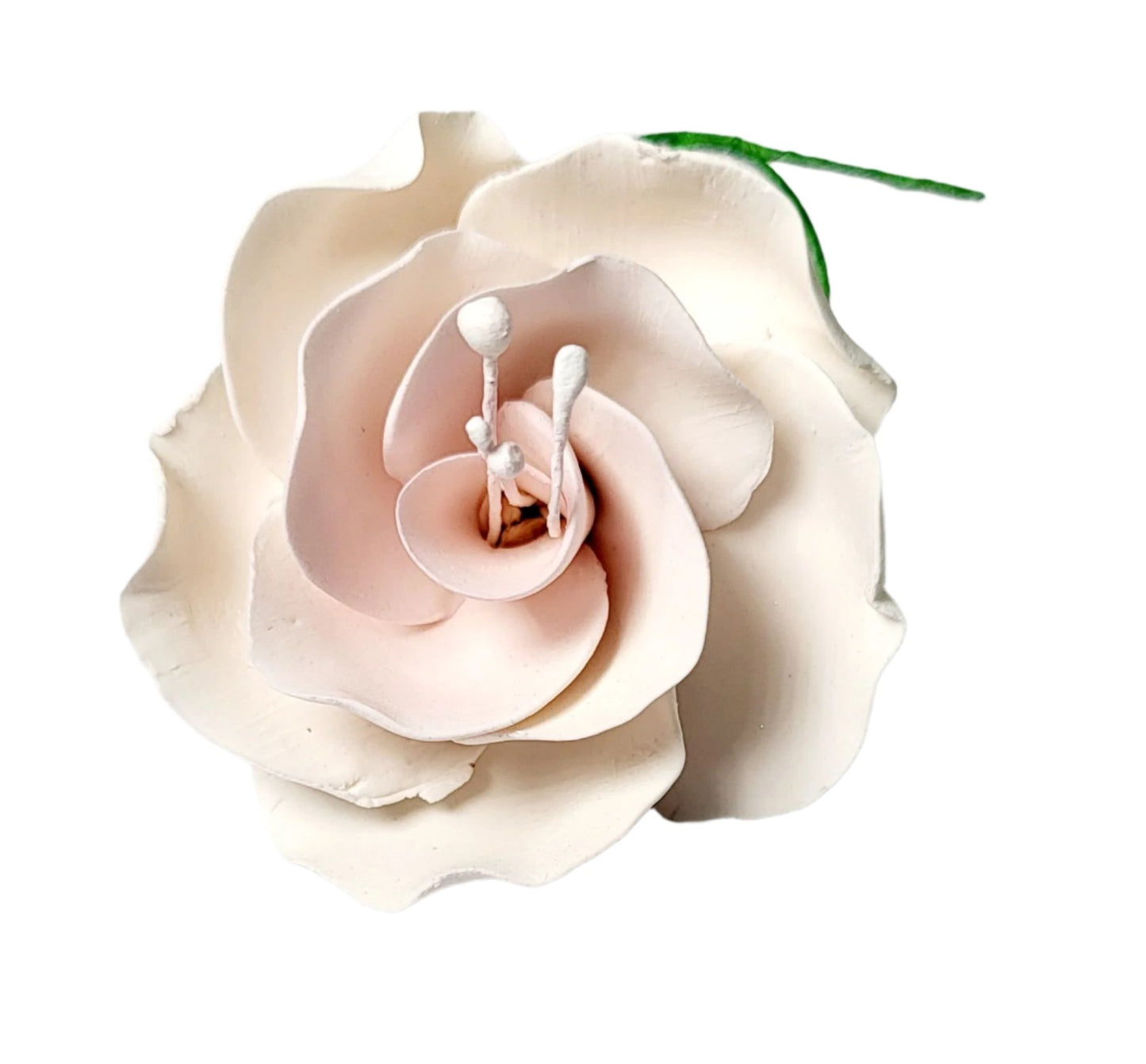 A wired pink dog rose icing flower made of sugar paste, designed for cake decoration.