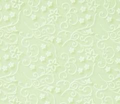 Wilton imprint mat with a graceful vine pattern used to emboss fondant or stencil designs on cakes.