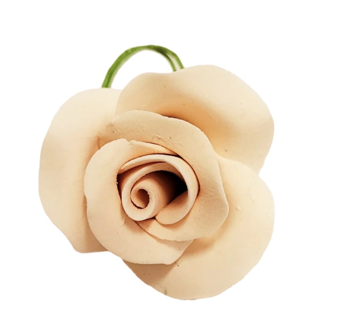 Single wired gum paste rose in pale ivory with apricot tone. Approx 1.2 inches.