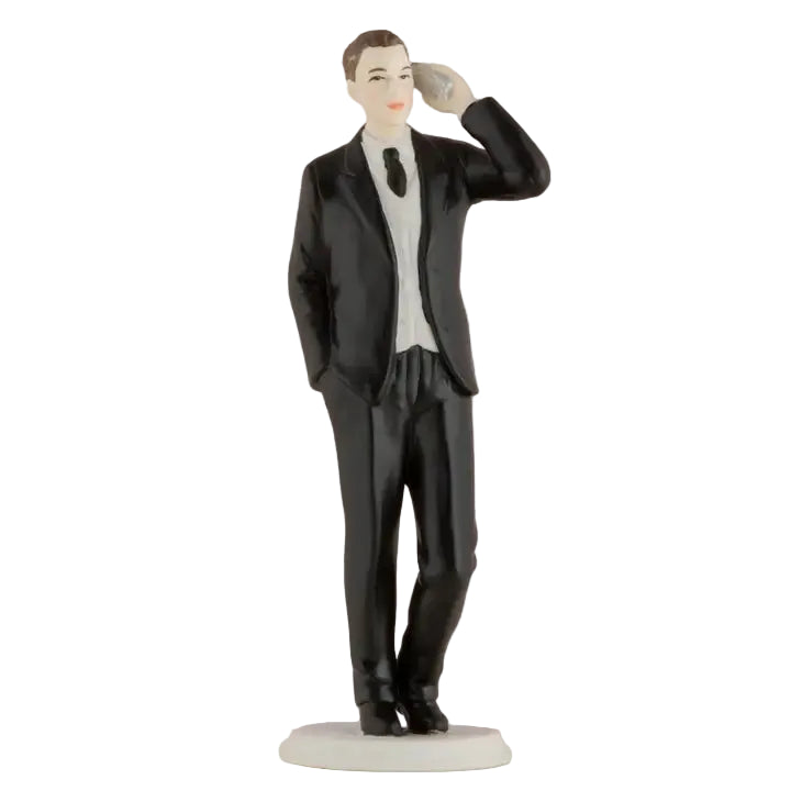 Hand‑painted porcelain cake topper of a man in a suit making a phone call, 14.5cm tall.