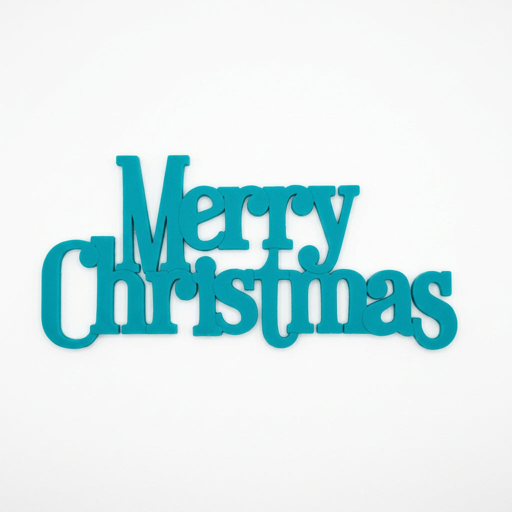 Large plastic Merry Christmas cake plaque in bright teal. measuring approximately 13.8cm wide by 6.2cm high.