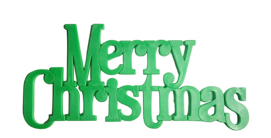 Large plastic Merry Christmas signs, green, approx. 13.8cm x 6.2cm, used for decorating cakes or platters. Non‑edible decoration, remove before serving.
