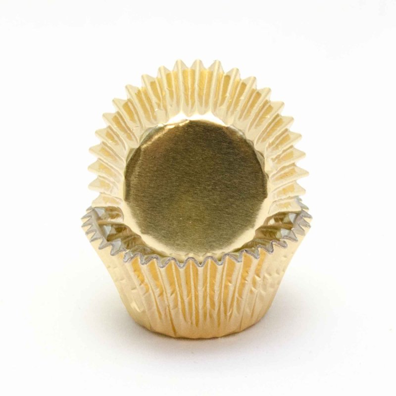 Stack of mini gold foil cupcake cases with a 3cm base, used for baking small cupcakes and treats.