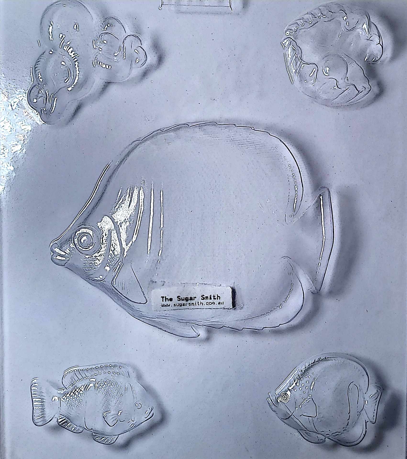 Dive into creativity with our Ocean Creatures Chocolate Mould, featuring a detailed fish, octopus, clam shell, and oyster design. Whether you're working with melted chocolate, fondant, or candy melts, this food-safe plastic mould delivers crisp, professional results every time.