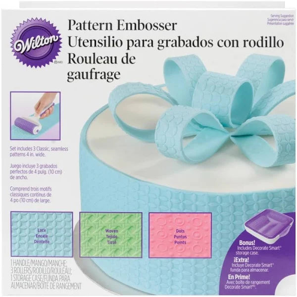 Wilton Pattern Embosser shown with its ergonomic handle, three silicone rollers in lace, woven and dot designs, and a hard plastic storage case.