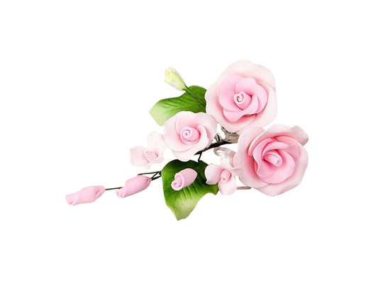 A pink medium rose spray made of gum paste designed for cake decorating.