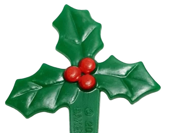 Pack of four puffy plastic holly picks with green leaves, approx. 6cm tall x 3.8cm wide, used for decorating cakes, cupcakes, and platters. Non‑edible decoration, remove before serving.
