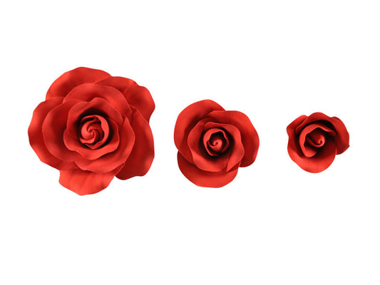 Set of three red fondant roses with curly petals and wire, sized 4cm to 8cm, ideal for romantic cake designs.