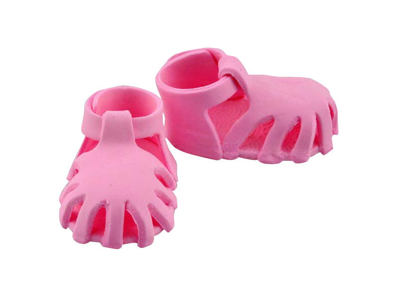 A pair of pink edible fondant sandals with straps, designed for cake decoration.