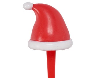 Pack of two plastic picks with Santa hat design, approx. 6.3cm tall x 2.8cm wide, used for decorating cupcakes, cakes, or platters. Non‑edible decoration, remove before serving.