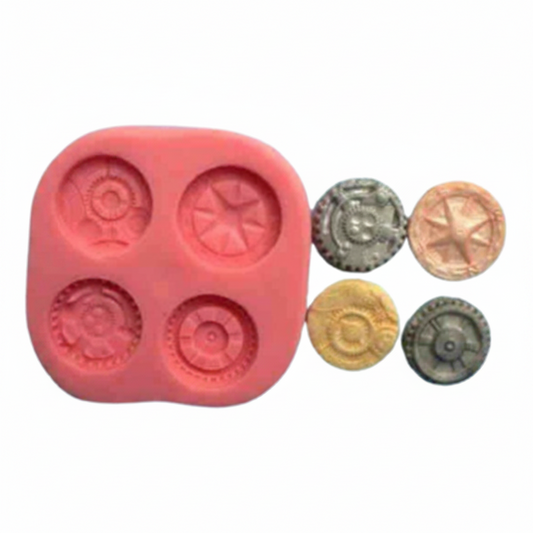 Silicone mold with circular cavities and small metal coin-like objects can be used with chocolate fondant and gum paste on a white background.
