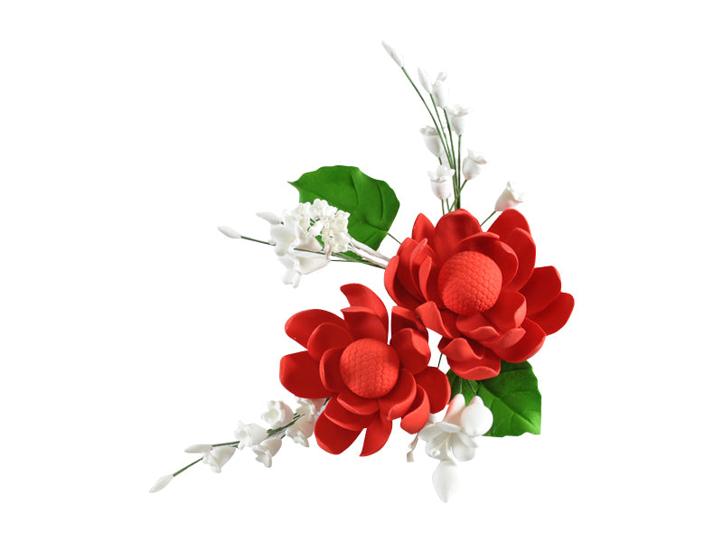 A wired red and white icing flower spray with green leaves, designed to be placed on a cake.