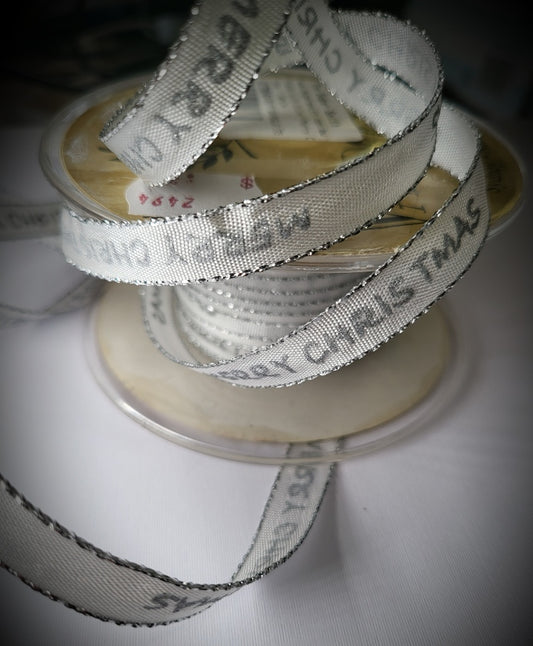 White Vandoros ribbon featuring elegant silver ‘Merry Christmas’ script, 10mm wide, premium Australian‑made ribbon suitable for cakes, gifts, and festive wrapping from The Sugar Smith